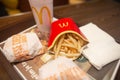 McDonald menu with french fries, hamburger and cola on a plate in McDonalds restaurant