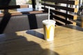 McDonald Milk Cocktail Milkshake In Big White Cup With Logo, Paper Straw on Table In