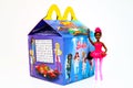 McDonald`s Happy Meal cardboard box with Mattel Barbie doll Royalty Free Stock Photo