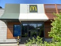 McDonald`s logo sign. McDonald`s Drive restaurant building