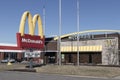 McDonald\'s Restaurant. McDonald\'s is offering employees higher hourly wages, paid time off, and tuition payments