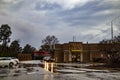 McDonalds fast food restaurant in the rain Front entrance and drive thru storm clouds