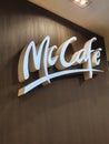 McDonalds McCafe restaurant logo on wooden wall