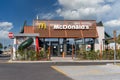 McDonalds restaurant on cloudy blue sky. Royalty Free Stock Photo