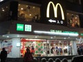 McDonalds shop, logo in China on top of shops with Christmas decorations