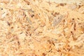MDF plywood veneer. OSB board texture and background, made of brown wood chips sanded into a wooden chipboard. Close up Royalty Free Stock Photo