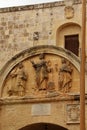 Mdina, Malta, July 2014. Fragment of the old stone wall with the image of the three saints