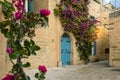 Mdina, Malta: traditional Maltese limestone house with bright purple flowers Royalty Free Stock Photo