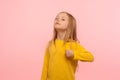 This is me! Portrait of arrogant self-confident preschool girl pointing herself and looking proudly Royalty Free Stock Photo