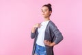 This is me! Portrait of proud brunette girl pointing at herself, looking arrogant and selfish. isolated on pink background