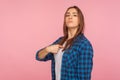 This is me! Portrait of proud self-confident girl in checkered shirt pointing herself and looking arrogant