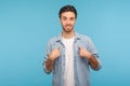 This is me! Portrait of self-confident narcissistic man in worker denim shirt smiling satisfied and pointing himself Royalty Free Stock Photo