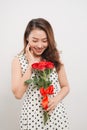 Is it for me. Waist up portrait of joyful young lady receiving red rose Royalty Free Stock Photo