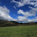 Meadow and cloudy sky in Pyrennes. Royalty Free Stock Photo