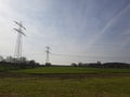 Meadow with high voltage power lines Royalty Free Stock Photo