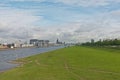 View on River Rhine with Kranhaus buildings and cathedral from the green borders of Poller Wiesen park Royalty Free Stock Photo