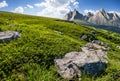 Meadow with huge stones on top of mountain range Royalty Free Stock Photo