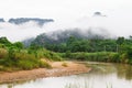 Meadow,lake,mountains on cloudy blue sky background in Phangnga province,South of Thailand Royalty Free Stock Photo