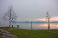 Meadow and park trees submerged by lake water Royalty Free Stock Photo