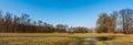 Meadow with seasonal oxbow lake and trees around near Petrvaldik in CHKO Poodri in Czech republic