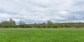 meadow with fresh green spring trees in the flemish countryside