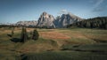 Meadows at Alpe di Siusi during autumn with view to mountains of Plattkofel and Langkofel in the Dolomite Alps from above Royalty Free Stock Photo