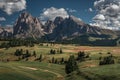 Meadows at Alpe di Siusi during summer with view to mountains of Plattkofel and Langkofel in the Dolomite Alps Royalty Free Stock Photo