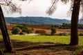 Meadows  and cultivated fields of catalan countryside in spain with house trees and hills at with in autmn with old masia house Royalty Free Stock Photo