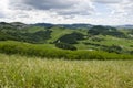 Meadows, green hills and clouds Royalty Free Stock Photo