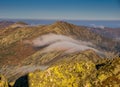 Meadows and Hills in Low Tatra Mountains National Park over clouds, Slovakia landscape in autumn. Royalty Free Stock Photo