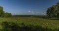 Meadows over Stedra village in Slavkovsky les national park in summer day Royalty Free Stock Photo