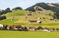 Meadows with wooden houses Royalty Free Stock Photo