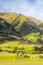 Meadows with wooden houses Royalty Free Stock Photo