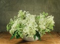 Meadowsweet. Still life. Bouquet of meadow flowers in white pots Royalty Free Stock Photo