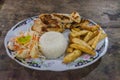 Meal in Colombia - grilled chicken breast, fries, rice and a sal Royalty Free Stock Photo