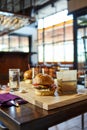 Meal commercial photography - traditional american burgers in restaurant setup. Blurred interior background