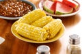 Meal with corn on the cob on a plate