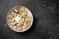 Meal of dumplings and sour cream on black stone table Royalty Free Stock Photo