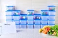 A meal plan for a week on a white table among set of plastic containers for food and food. Proper nutrition during the week Royalty Free Stock Photo