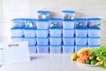 A meal plan for a week on a white table among set of plastic containers for food and food. Proper nutrition during the week Royalty Free Stock Photo