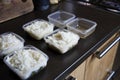 Meal prep. Stack of home cooked rice and chicken dinners in containers ready to be frozen for later use as quick and Royalty Free Stock Photo