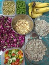 Meal prepping indian style. Peanuts, quinoa. Rose petals, French beans, mixed cut bell peppers and bananas.