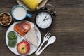 Meal time with alarm clock at lunch time Royalty Free Stock Photo