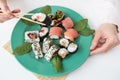 Meals, various types of maki sushi, philadelphia, maki, salmon, rice, salad. Delicious and healthy food Royalty Free Stock Photo
