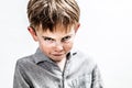 Mean bully boy expressing scary revenge or dark retaliation, isolated Royalty Free Stock Photo