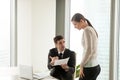 Mean furious boss reprimands incompetent female employee for bad