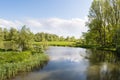 Meandering creek in a rural landscape in springtime Royalty Free Stock Photo