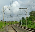 Railway curve with electric poles Royalty Free Stock Photo