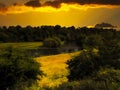 Meandering river in the light of the setting sun Royalty Free Stock Photo