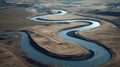 Meandering river stream winding through arid fields a snake like watercourse from an aerial perspective during daylight Royalty Free Stock Photo